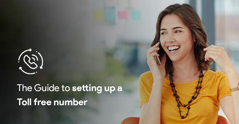 The image shows a girl happily talking in mobile phone wearing a yellow dress and in the black background a line is written "the guide to setting up a toll free number" in white letters.